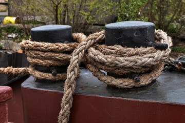 Fototapeta na wymiar Bollard and rope ship close-up