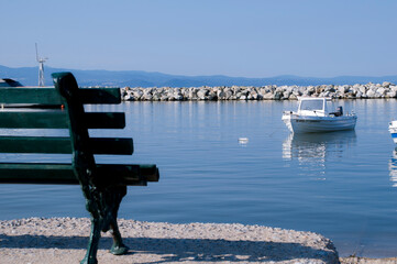 Sitting on the bench by the beach