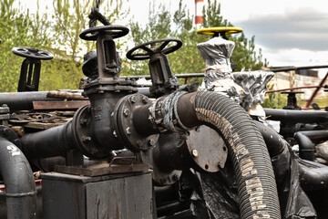 Cranes and pipes on a fuel tanker, a close-up fragment