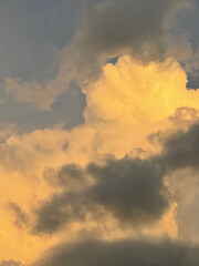 Obraz na płótnie Canvas beautiful big lush yellow gray clouds. aesthetic photo