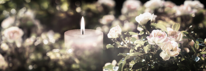 white rose-flowers around burning candlelight with vibrant blurred bokeh lights, beautiful floral...