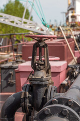 Cranes and pipes on a fuel tanker.