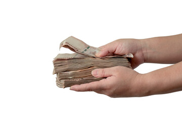 A picture of a hand holding a large amount of money in front of her.
