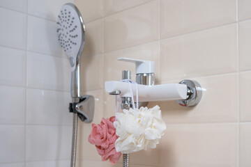 Interior of a modern shower head in a bathroom at home. Modern bathroom design. White bath, shower head