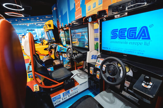 26 May 2022, Antalya, Turkey: Retro Sega video game for child racers with steering wheel in amusement park
