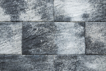 multicolored gray floor tiles or paving stones as a background.