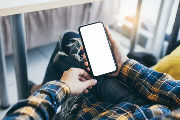 cell phone blank white screen mockup.hand holding texting using mobile on desk at office.background empty space for advertise.work people contact marketing business,technology