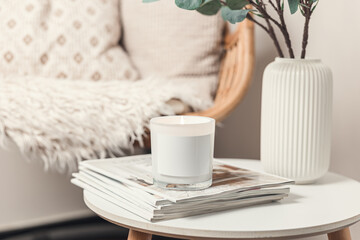 Candle lit on a coffee table in a relaxing atmosphere
