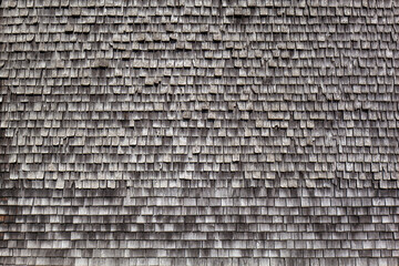 Fassade verkleidet mit Schindel aus Holz.
Schindel auf Gebäude. Facade clad with wooden...