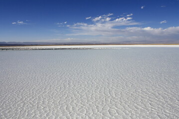 Salt flat at Salar de Atacama in Chile with Licancabur volcano background