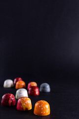 Sweet color chocolate bonbons. Modern hand painted chocolate candy. Product concept for chocolatier