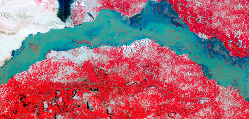Top view of Indus River, Manchhar Lake, flooded fields, satellite image, red vegetation, turquoise...