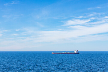 The crude oil tanker Olympic Flag on a calm sea under a blue sky in The Skagerrak off Denmark