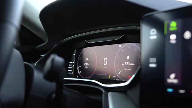 A luxurious car is turned on and accelerates - closeup on the speedometer