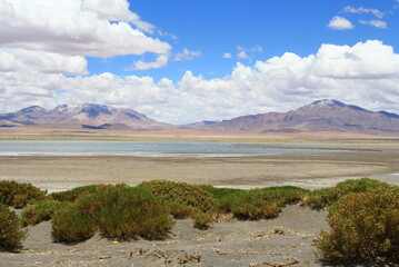 Salt lagunas and volcanos and red rocks southern from San Pedro de Atacama. Stunning scenery at Atacama desert, Chile, South America