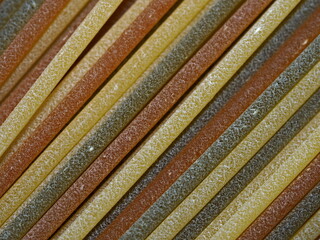 Close-up of colorful spaghetti noodles.
A macro photo showing the food. Italian pasta. Shallow depth of field