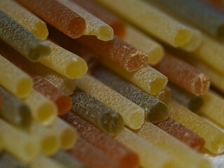 Close-up of colorful spaghetti noodles.
A macro photo showing the food. Italian pasta. Shallow depth of field