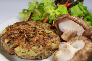 Delicious vegan food. Mushroom meatballs and salads.