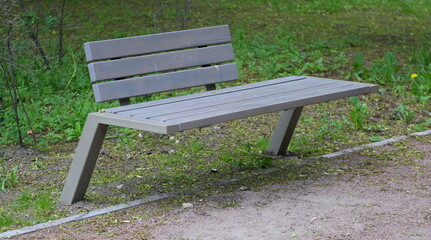 Modern wooden grey park bench for relaxation