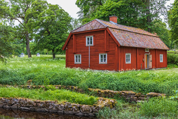 Fototapeta premium Old red timber house in the countryside