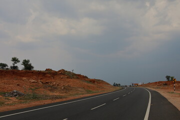 asphalt road texture with a white stripe in a mountainous range