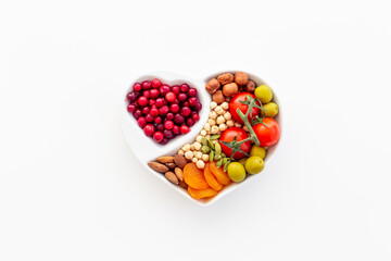 Diet cooking concept with healthy food in heart shaped plate
