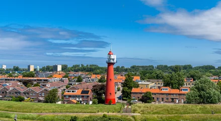 Deurstickers view of the lighthouse and village of Hoek van Holland on the Rhine Estuary © makasana photo