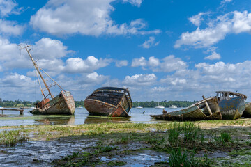 view of the boat graveyard at Pin Mill on the River Orwell in Suffolk at low tide