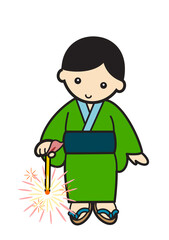 線香花火をする男の子