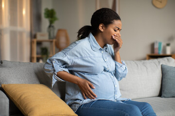 Pregnant Black Lady Suffering From Nausea Having Morning Sickness Indoor