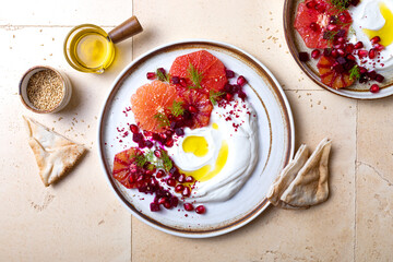 Labneh middle eastern lebanese cream cheese dip. Labneh with grapefruit,  roasted beetroot,...