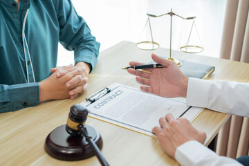 Law consultancy concept A male lawyer finding out some vague information on the contract and asking...