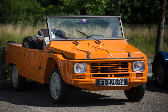 Mulhouse - France - 12 June 2022 - Front view of orange Citroen Mehari parked in the street