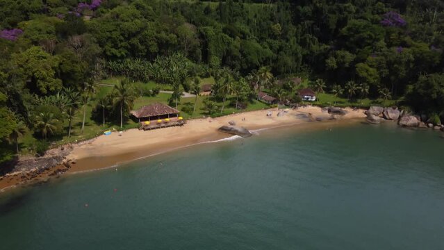 Aerial view to a small beach with the atlantic forest at the coast of Paraty, Rio de Janeiro - Brasil