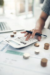 Keep an eye on your income. Closeup shot of an unrecognisable businesswoman calculating finances in an office.