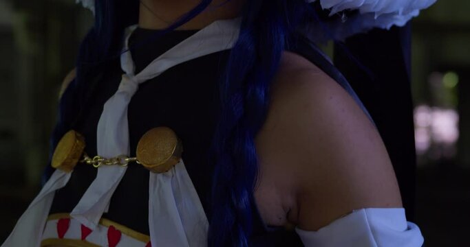 Descending close up of a cosplayer girl wearing wendy belserion cosplay