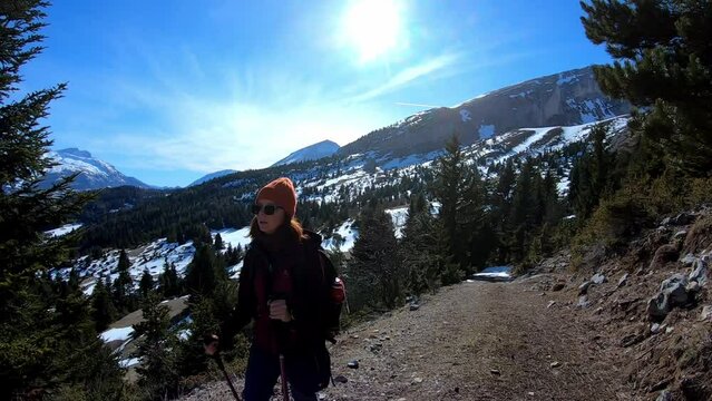 Young caucasian woman hike hand sticks Mountain snow Location : D&eacute;voluy, Hautes Alpes, french alps