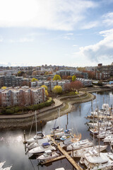 Aerial View of Residential Homes, Boats in Marina and Modern Cityscape. False Creek, Downtown Vancouver, British Columbia, Canada.