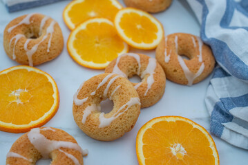 sweet home made orange donuts on a table