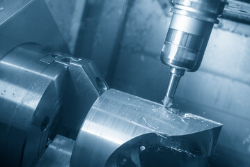 The multi-tasking CNC machine milling the automotive transmission part.