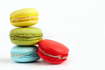 Stack of colourful macaroons or macaron isolated on white, French dessert background
