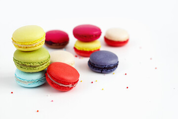 Stack of colourful macaroons or macaron isolated on white, French dessert background
