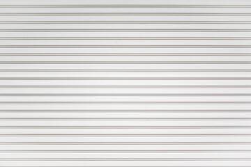White metal roller shutter door background. Steel stripe horizontal lines of iron foldable metal...