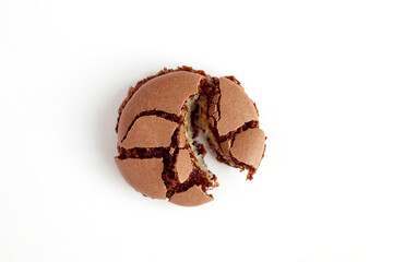 Cracked chocolate biscuit macaroon isolated on white background, Top view