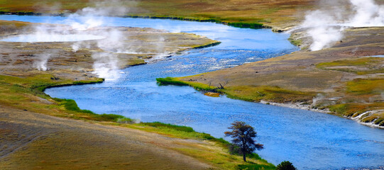 River Flowing with Steam Rising in Wilderness Hot Springs
