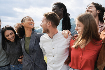 Multiethnic group of friends having fun together outdoor - Millenial friends laughing together...