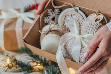 Fototapeta na wymiar Hand decorated Christmas Gift box with bow tie