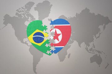 puzzle heart with the national flag of brazil and north korea on a world map background.Concept.