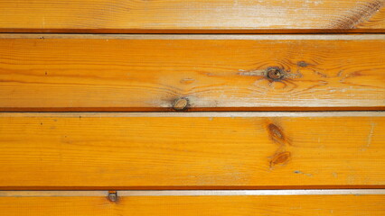 natural background of a brown wooden board painted with a protective layer and varnish. wood for the construction and cladding of the wall of the house