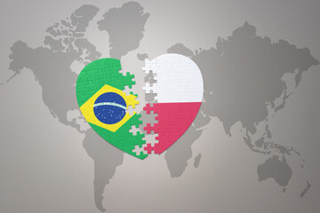 puzzle heart with the national flag of brazil and poland on a world map background.Concept.